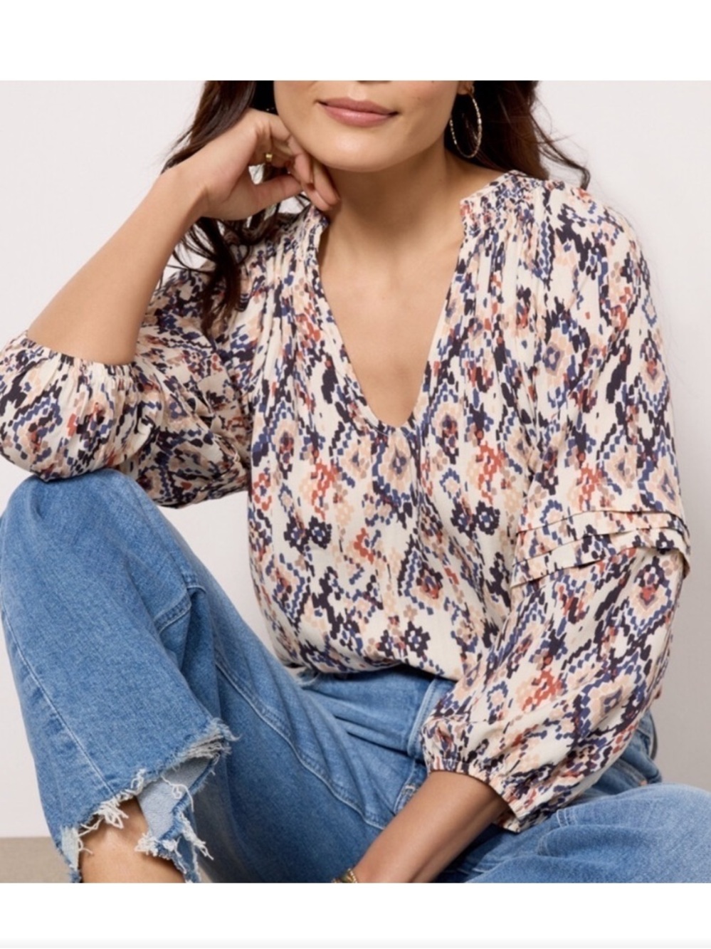 Evereve Layla Ikat top in a multicolor geometric print with smocked V-neckline